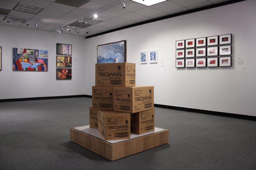 Installation view. (Foreground) Trojan Boxes by Adam Rolston; (Background, left to right)Joey Terrill, Kia Labeija, Frank Moore, and Dean Sameshima. 