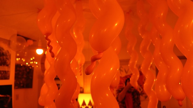 Spiralling orange balloons. Photo credit: Ryan Paluczak.