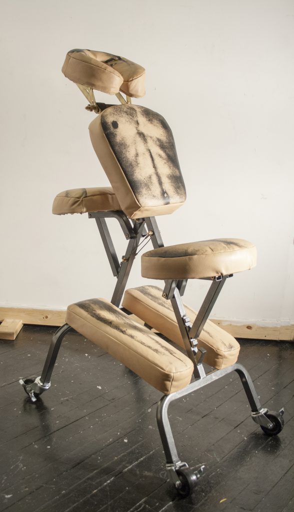 "Kneeling Youth," 48"x32"x18” Screen print on natural tooling leather, modified massage chair, brass hardware, casters. Leather chair with imprint of body. 