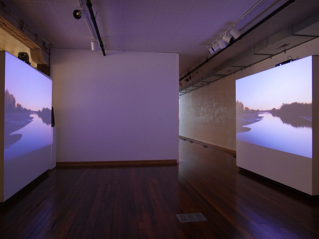 A two-channel video installation shows the riverbed of the Rio Grande, which helps mark the U.S.-Mexico border by Allison Walsh and Alexis Carballido, 2018. Image courtesy of the artists. 