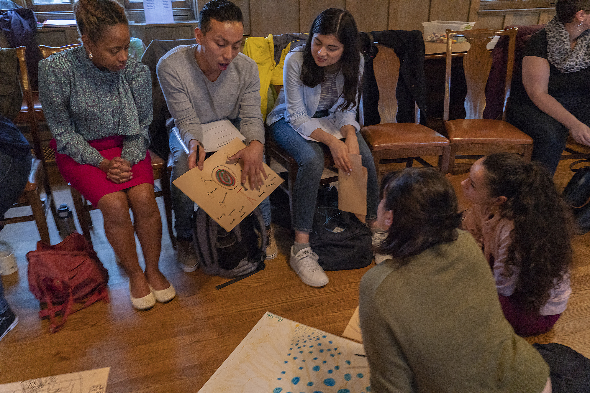 Image: Leah Gipson (at left, in pink skirt) works with participants in an art therapy workshop at Hull-House in October. Photo courtesy of Jane Addams Hull-House Museum / Jesse Meredith.