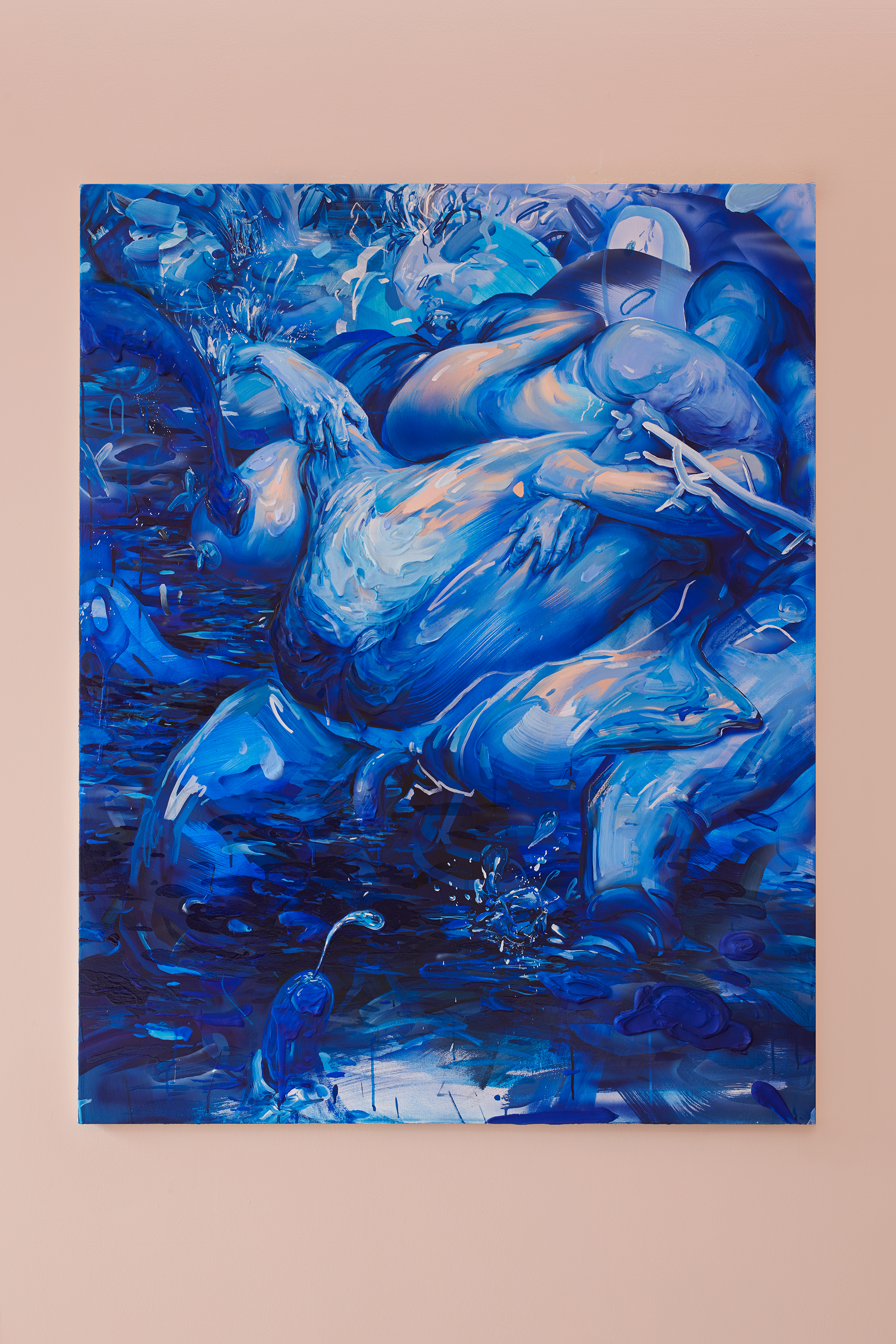 Image: "She Bad" is a painting consisting of mostly vibrant blue shades hangs in portrait orientation. There is an abstract body with bulbous shapes and a phallic shape at the bottom. Image courtesy of the artist.