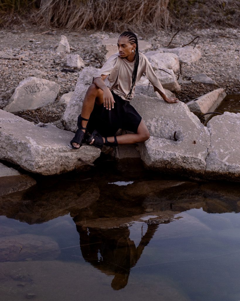 Image: Morenxxx perches on broken pieces of concrete over water. Photo by Ryan Edmund.