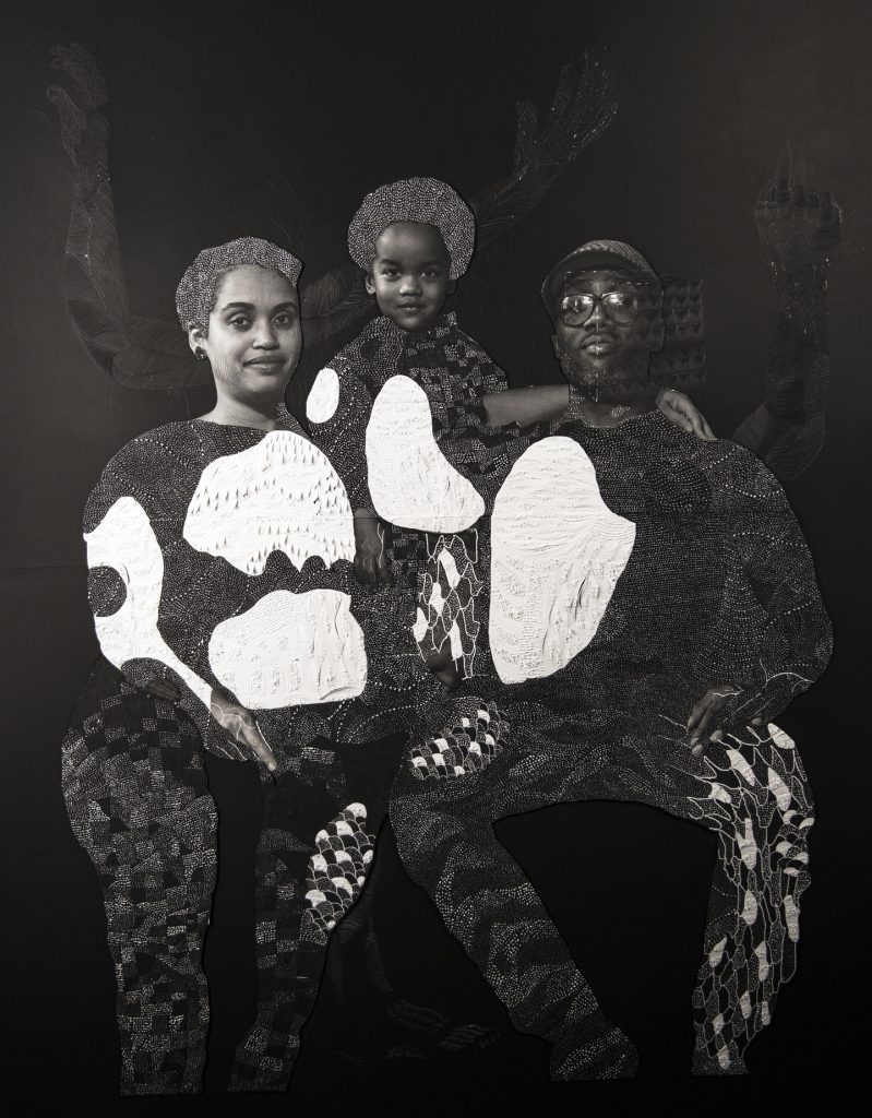 Image: Nate Lewis, “Sankofa,” 2018. A photo collage. A family is seated and looks out at the viewer. A woman is on the left, a man on the right, and a child in the middle. The image is black and white. The paper is textured to create patterns in the place of their clothes. In the background, three arms that are delicately textured and patterned reach up toward the top of the image. Image courtesy of Smithsonian Institution Traveling Exhibition Service and the artist.