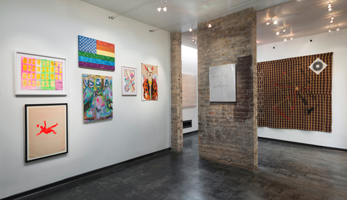  Image: Installation shot of Iceberg Projects exhibition “David Wojnarowicz: Flesh of My Flesh,” June 23 – August 5, 2018. On the left wall, a series of images are hung in rows. A sculpture of a head is encased in glass on the right way. Directly in front of the viewer, an outdoor green space is visible through a glass door. Image courtesy of Iceberg Projects.  