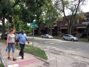 Image: Astrid Kaemmerling shown walking Enos Park being led by participant of the Enos Park Walking Laboratory (2017), Location: 5th Street and Union Street, Enos Park, IL. Photo by Danielle Wyckoff.