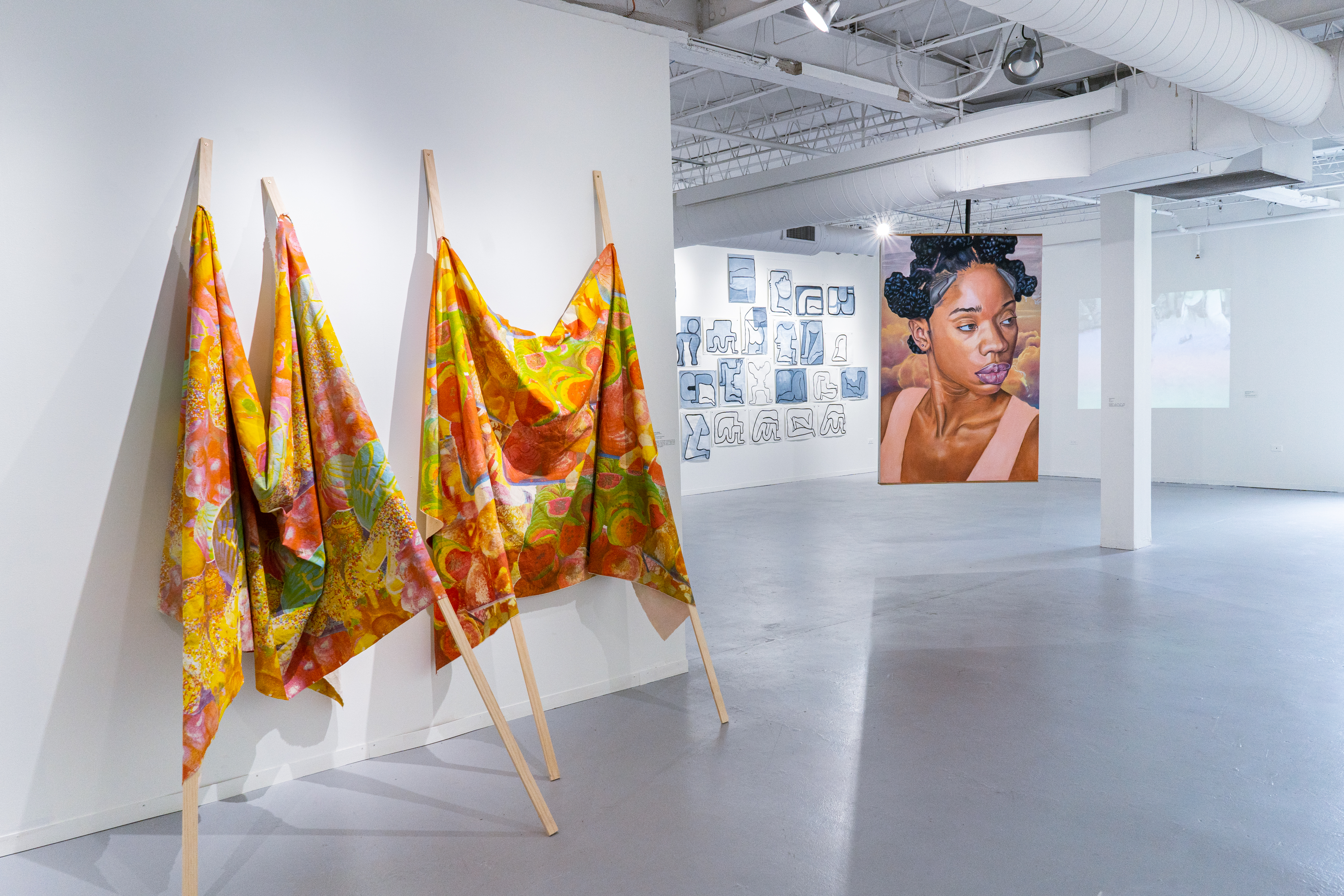 Panoramic view of HPAC's Kanter McCormick Gallery, installation of the Tokyo Show: Black and Brown are Beautiful. Features Brandon Breaux's 2017 painting Pilot 11.