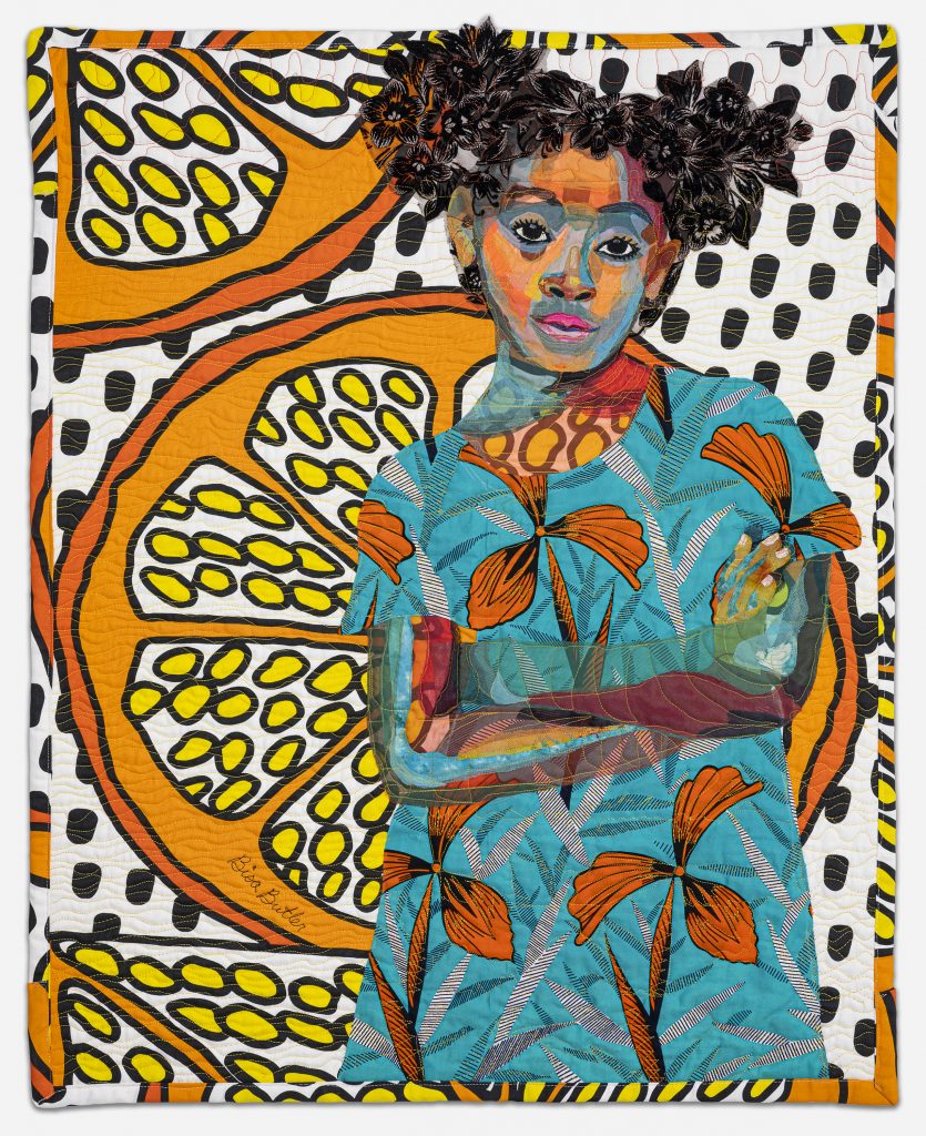 Image: Bisa Butler. Anaya with Oranges, 2017. Dimmitt Davies Collection. © Bisa Butler. The textile piece portrays a girl with her arms folder looking straight at the viewer. She wears pigtails and colorful, orange and blue attire. Larger than life slices of oranges make up the background pattern. Photo by Margaret Fox. Image courtesy of the Art Institute.