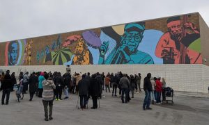 Featured image: (Mariano's mural) Color Me South Side, 2019 by Dorian Sylvain. A crowd of people stand in front of a colorful mural depicting several people. Photo by Chris Devins.