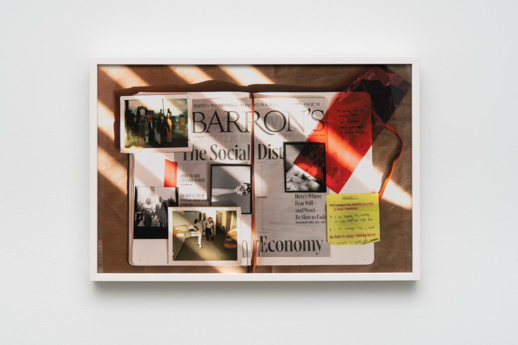 Image: Jazmine Harris, Untitled Scrapbook, 2020, archival pigment print. The piece is an image of the artist's scrapbook. In the image, the scrapbook sits open on a wooden surface; the pages are collaged with newspaper clippings detailing the pandemic, family photos, and a note to self on a lone yellow post-it. Photo courtesy of the artist and curator.