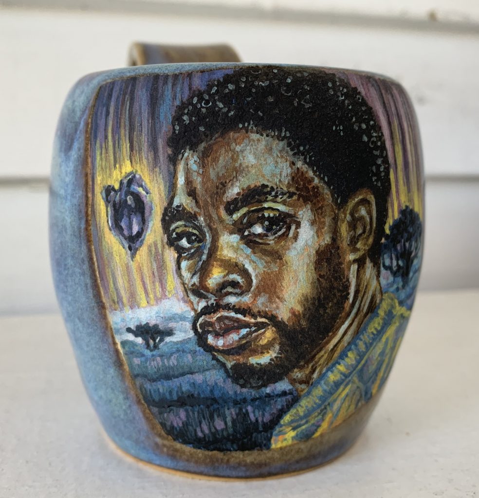 Image: Cristal Sabbath, The King has returned to the ancestral plane, 2020
Stoneware with underglaze watercolors and cone 6 glaze. A vessel with a vibrant portrait of Chadwick Boseman. Photo by  Jonathan Castillo. Courtesy of Glass Curtain Gallery.