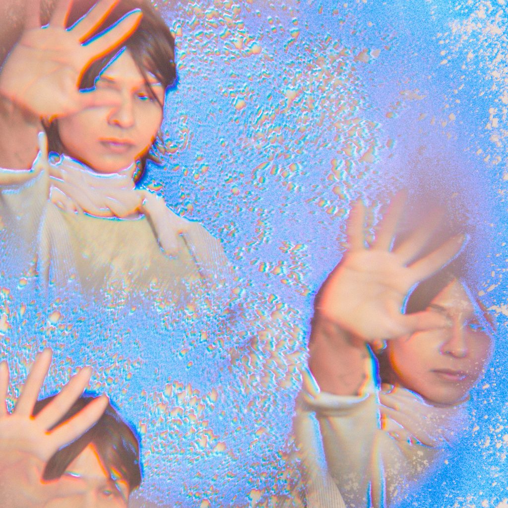 Image: Marissa Macias faces the camera with one hand up with the palm out. Three images of Marissa are arranged like a kaleidoscope on a silvery-blue background. Photo by Sarah Joyce.