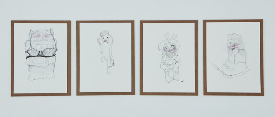 Image: An installation view of four graphite drawings by Sofia Moreno hanging on a white gallery wall. They each depict a trans character. Three of the drawings have pink on the mouth and one has a slash of pink on the eyes. Image by Ian Vecchiotti, courtesy of Hans Gallery.