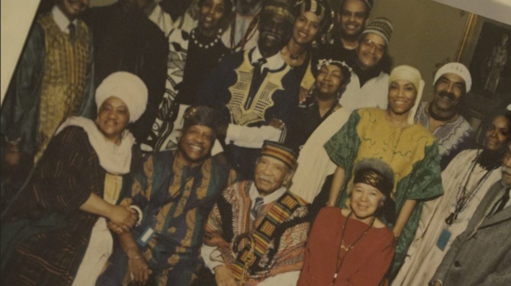 Image: Blackburn (second row, third from left)  and the elders of dance Africa including Jimmy Payne (front row, second from left) and Julian Swain (front row, second from right). Photo of image by Wills Glasspiegel.