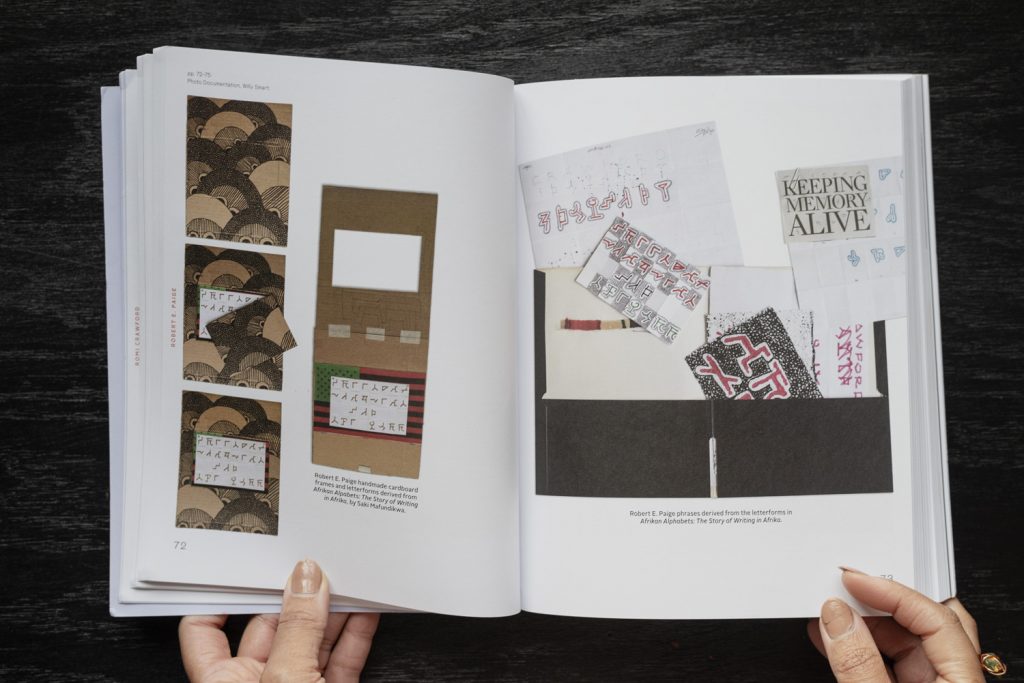 Image: The book Fleeting Monuments for the Wall of Respect is open to pages 72 and 73, showing a compilation of inspirations and related works by artist and designer Robert E. Paige, documented by Willy Smart. On the left page are a series of handmade cardboard frames and letterforms derived from 'African Alphabets: The Story of Writing in Afrika,' by Saki Mafundikwa. On the right page are drawings and typographies by Paige created from those letterforms. Photo by Ryan Edmund Thiel.