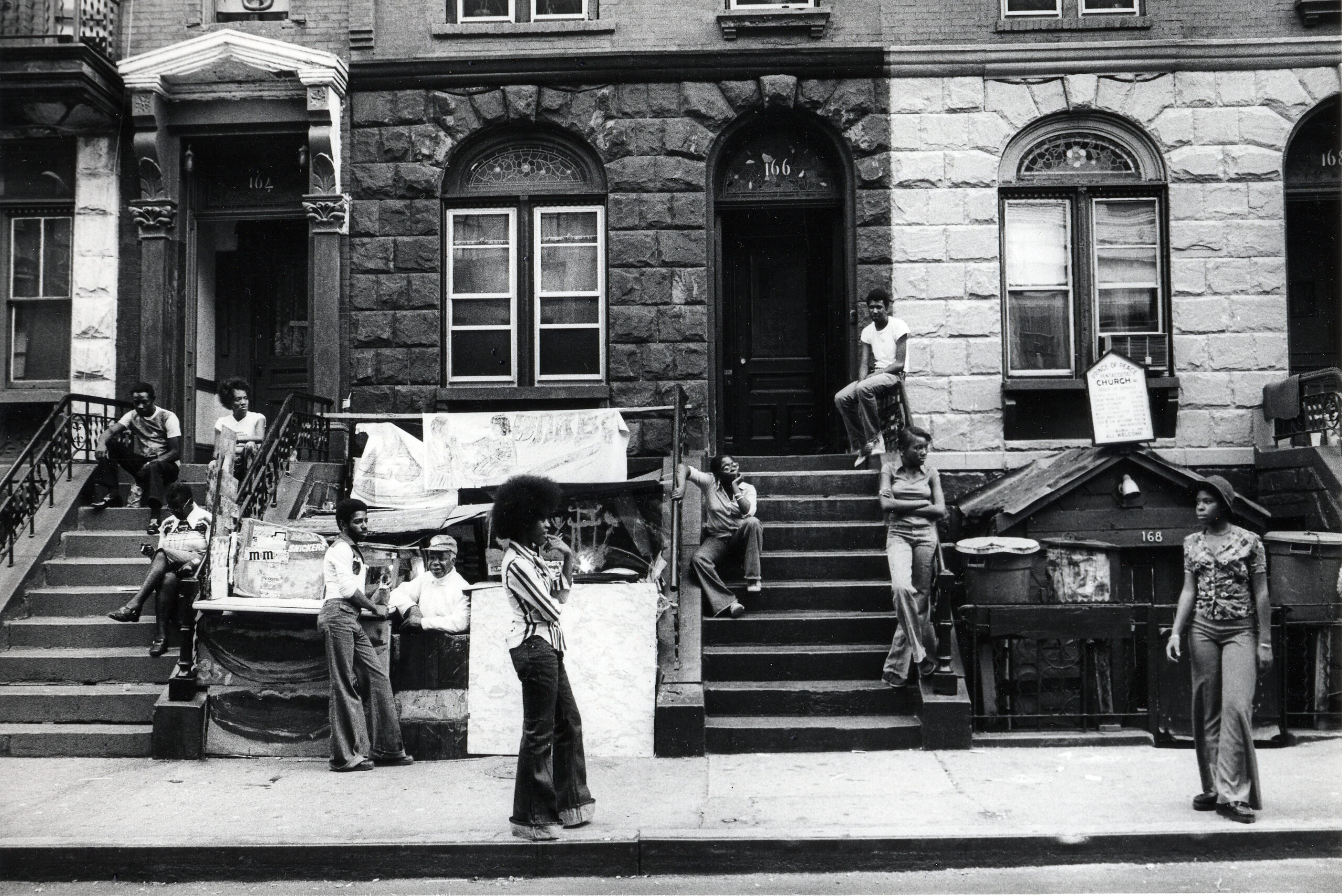 Harlem Street, 1976–77. Gelatin silver print, 5 5/16 x 8 15/16 inches. © Carrie Mae Weems. Courtesy of the artist and Jack Shainman Gallery, New York.