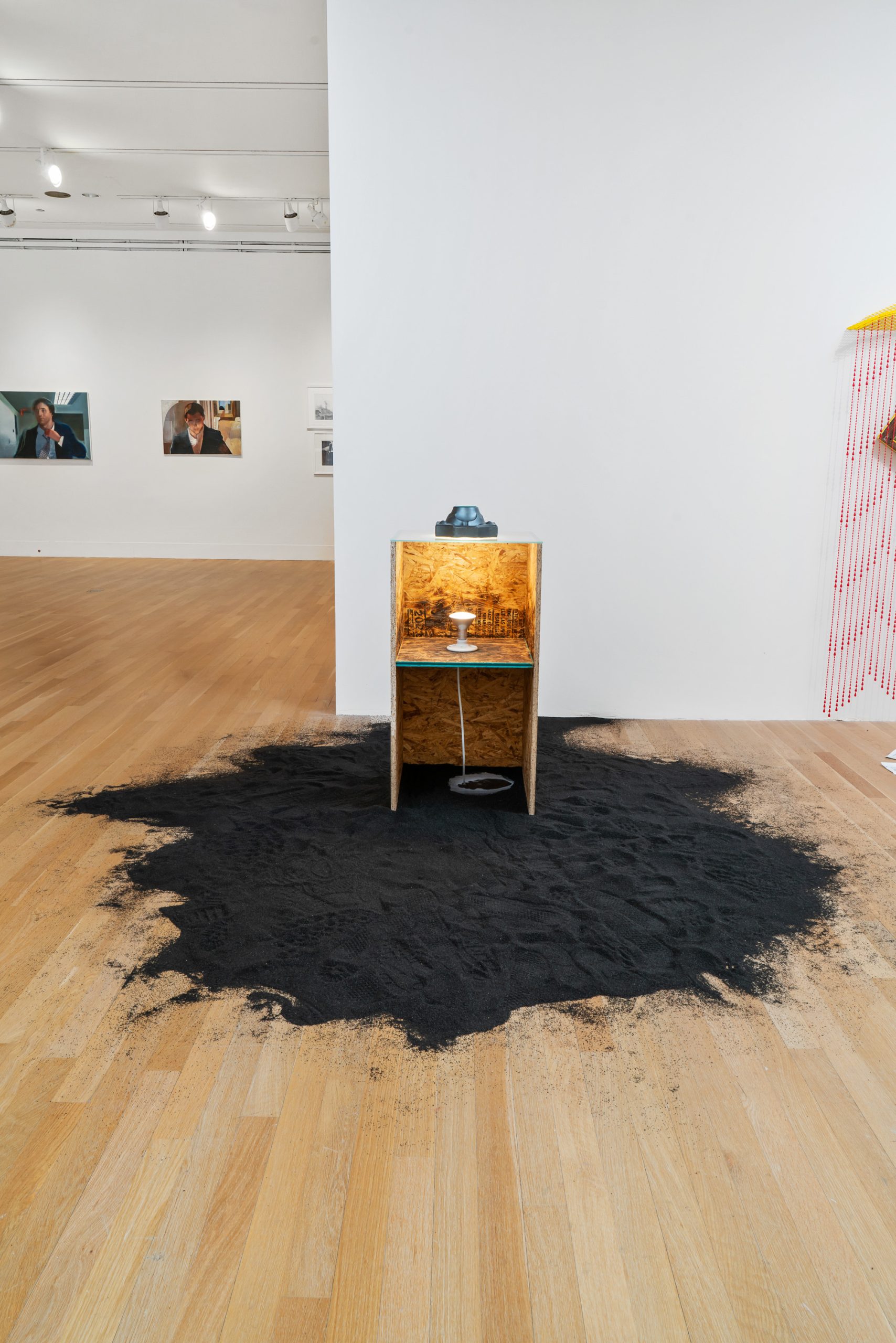 Image: I didn’t think you’d be like that (Mold 1) by Scott Vincent Campbell.  A wooden structure sat on a large mound of a substance that looks similar to gunpowder. Photo by Robert Chase Heishman.