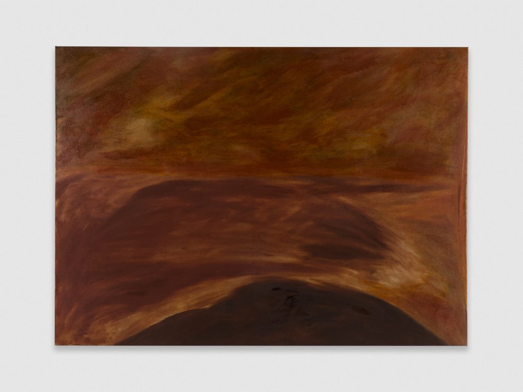 Image: Dominique Knowles, The Solemn and Dignified Burial Befitting My Beloved for All Seasons, 2022. Oil on linen, 46" x 64 1/4". An atmospheric abstract painting in earthy yellow ochre-brown tones shows a patch of dark soil at the bottom edge of the canvas, similar to that of a mound. Above the mound, the painter mimics the motion of the curved lines using gestural strokes in reddish earth tones. Atop, strokes in the same tones float up, skywards, implying a separation between monochromatic planes. Image courtesy the artist and PATRON Gallery, Chicago. Photography by Evan Jenkins.