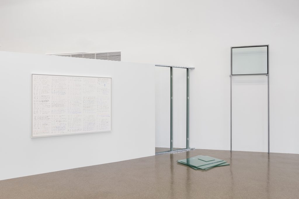 Image: Fear of Property, installation view featuring works by Rose Salane, 2022, the Renaissance Society. A print on the left wall and a small tower of stacked square glass sheets. Courtesy of the Renaissance Society at the University of Chicago. Photograph by Useful Art Services.