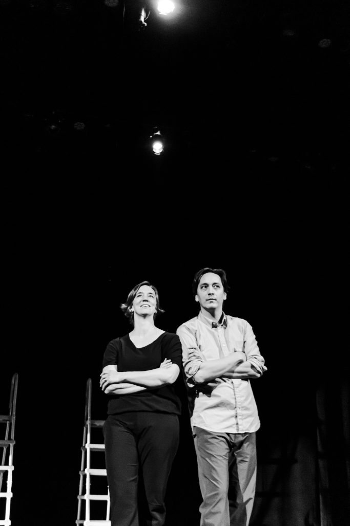 Image: Greyscale photo of Melinda Jean-Myers and Kurt Chiang, standing next to each other with their arms crossed. Kurt looks up to the right, Melinda looks up the left. Photo by Ella Kang.