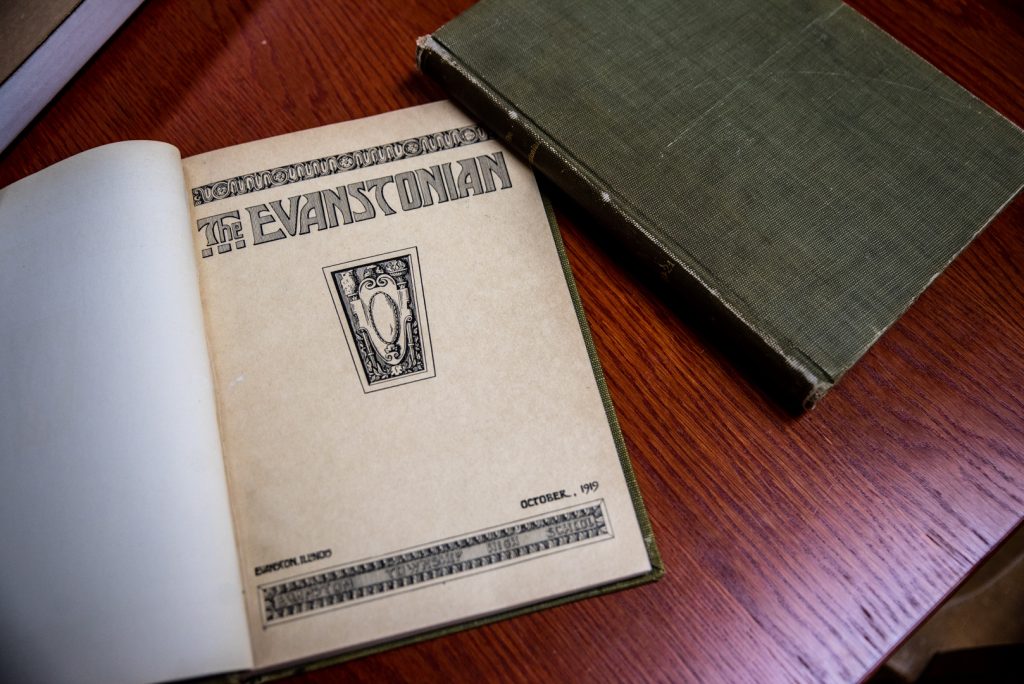 Image: Photo of an open copy of The Evanstonian from October, 1919 two on a wooden table. Photo by Edvetté Wilson Jones.