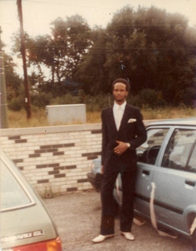 Image: Jerome wearing a black suit for a wedding. Courtesy of Alkebuluan and Jerome Merriweather.