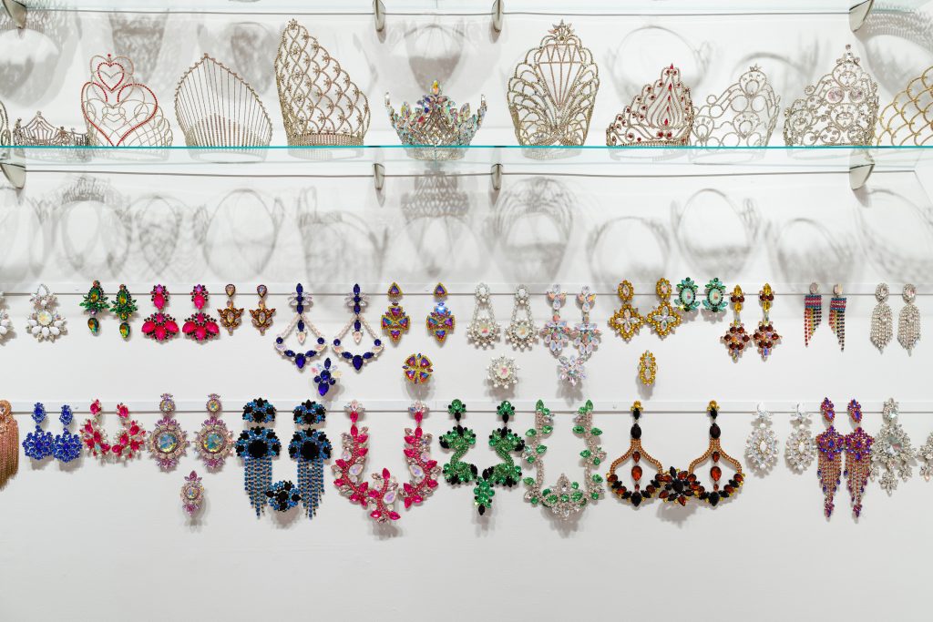 Image: Installation view: Faleasha Savage, Behind Closed Doors, 2022, Garments, jewelry, sashes, and crowns. Image courtesy of Bemis Center. 