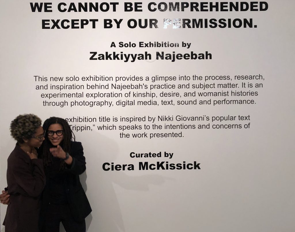 Image: zakkiyyah and Cierra standing in front of the title wall at the opening of the show "We cannot be comprehended except by our permission" at Blanc Gallery. Photo courtesy of the artists. 