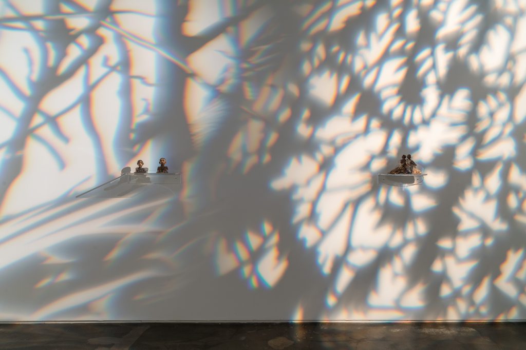 Image: Installation view of two ceramic pieces in Days Later, Down River. Left: Swimmer I & II, 2023. Ceramic, oxide. 5’’ x 7’’ x 3.5’’ and 5’’ x 7’’ x 4’’. Right: Flores, 2023. Ceramic, oxide. 7’’ x 11.5’’ x 6’’. Image courtesy of the artist and Monique Meloche Gallery.