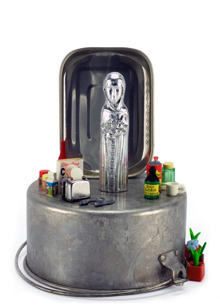 Elaine Luther, Our Lady of Perpetual Cooking, 2013. A silver virgin mary figure on top of a cooking pot with miniature spices and toy appliances. 