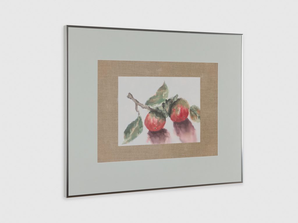 A watercolor painting of two pale-red and green persimmons attached to a small branch is surrounded by raw line and wide, sage-gray border. 