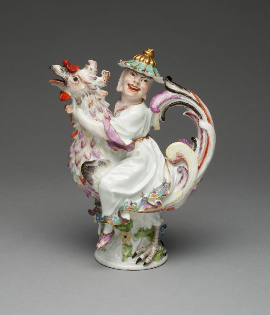 Image: Meissen Porcelain Manufactory (Manufacturer), Oil or Vinegar Cruet, c. 1737. Hard-paste porcelain, polychrome enamels, and gilding. 8 3/8 × 6 5/16 × 3 5/8 in. Modeled by: Johann Joachim Kändler (German, 1706-1775, active at Meissen, 1731-1775). Gift of Mr. and Mrs. Samuel Grober in honor of Ian Wardropper and Ghenete Zelleke through the Antiquarian Society. A mainly porcelain sculpture depicting a person riding a rooster.