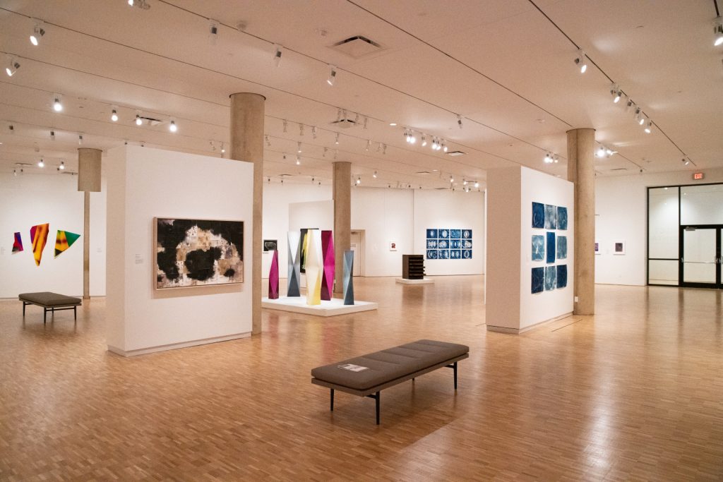 Image: Installation view, Direct Contact: Cameraless Photography Now, 2023. Two floating walls, columns, and multimedia work in a gallery space. Sidney and Lois Eskenazi Museum of Art, Indiana University. Photo: Shanti Knight.  