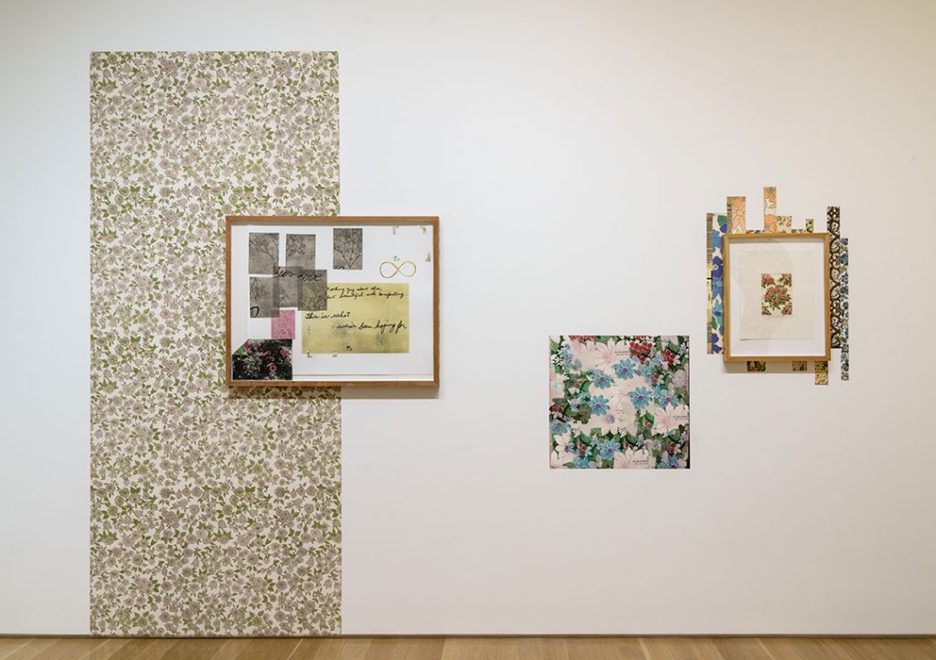 Image: Ruben Castillo installation from the exhibition Charlotte Street Fellows · 2023, Nov. 17, 2023 – Apr. 14, 2024. This section of the installation includes two framed mixed media works and various strips of floral wallpaper. Nerman Museum of Contemporary Art, Johnson County Community College. Photo: EG Schempf.