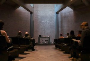 Image: participants sit in the pews at Augustana Lutheran Church to participate in the Deep Listening Workshop. Photo courtesy of Livy Snyder.