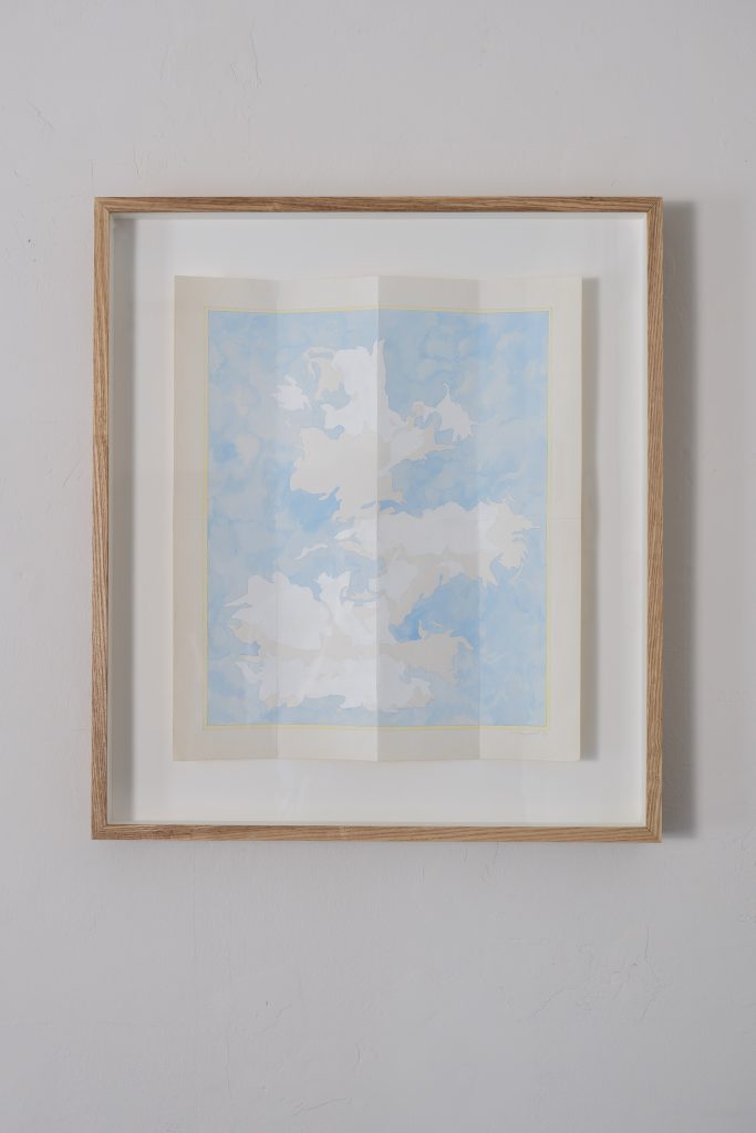 Image: Sheldon Till–Campbell, Map of the clouds just now, 2023. Gouache on Folded Paper. 14 x 16 in. A framed work on paper with a sky-blue background and white forms in the foreground. The paper is slightly folded so it is not laying flat. Photo credit: JI YAng. Instagram: @mr_he_he_he. Website: www.jiyang.co.