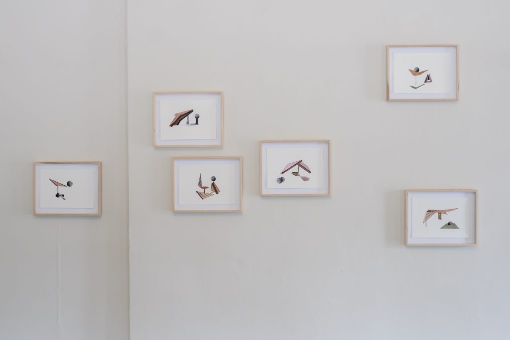 Image: An installation view of six collages on Aquafine paper by a Zulkhairi Zulkiflee. From left to right: The World Rolled off His Tongue, 2024; At the Precipice of Rubbish, 2024; In a Circle, They Took Turns to Be on Top of the World, 2024; Twins, 2024; The Gait of the World (Wings), 2024; and Kicking Around (Goalkeeper), 2024. Each piece is a framed work on a paper with an off-white background and architectural elements collaged in the foreground. Photo by JI YAng. Instagram: @mr_he_he_he. Website: www.jiyang.co.