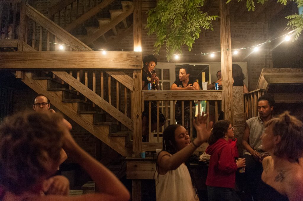 Image: Folks at the 2018 Chicago Archives + Artists Festival gather and dance in celebration. Photo by William Carmago.