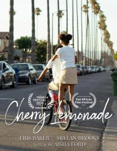 Image: Publicity poster for Cherry Lemonade. Two Black kids, one riding a bike, the other standing on the back pegs, facing a long as[halt stretch with tall palm trees running down its side. On the same side, cars parked parallel. On the bottom of the image is "Cherry Lemonade" in cursive. Image courtesy of Aisha Ford.