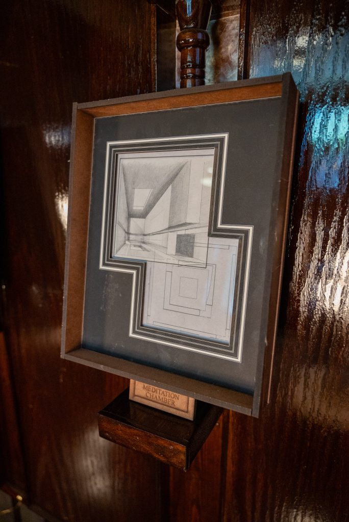 Right Image: An image of a wooden framed blueprint of a Meditation Chamber in the Greystone Home and Studio. Photography by Tonal Simmons.