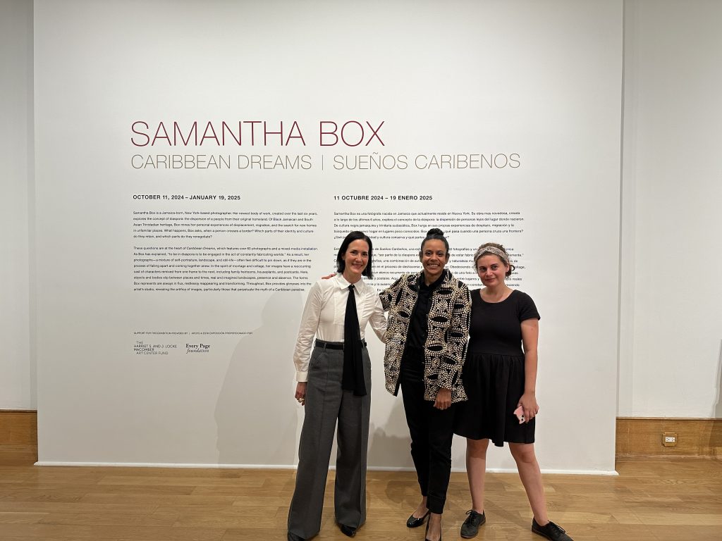 Left Image: A photograph of (left to right) John and Mary Pappajohn Director Kelly Baum, PhD, artist Samantha Box, and former Des Moines Art Center associate curator Mia Laufer, PhD. They stand in front of a large white wall containing exhibition text. Image courtesy of the Des Moines Art Center. 