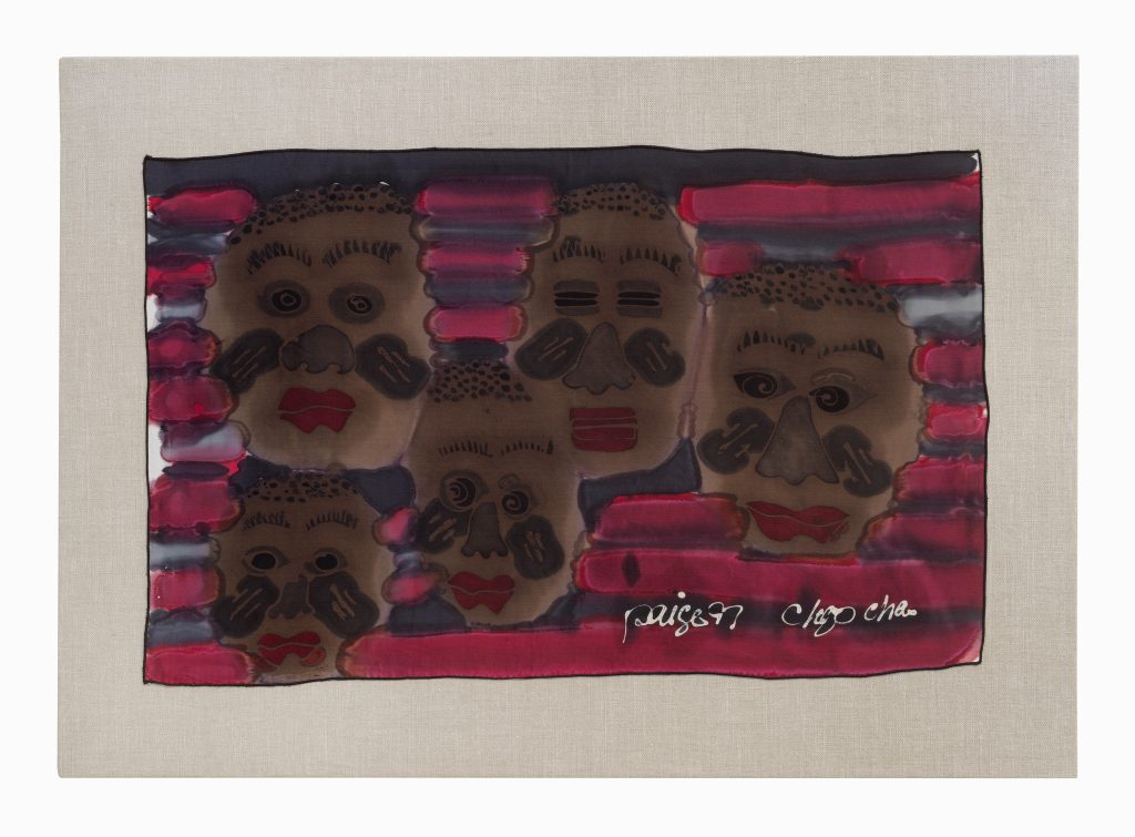 Image: Installation view of The United Colors of Robert Earl Paige, Hyde Park Art Center, 2024. A detail shot of a textile artwork. Five faces dominate the majority of the textile, each depicted with red lips, black splotches on their cheeks, and short hair. The background is alternating pink and purple horizontal lines. Photo by Tom Van Eynde.