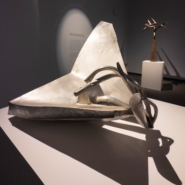 Image: Hunt, Glider, 1966, welded aluminum, 30⅜ x 36 x 31½ in. On loan from The Richard Hunt Trust 
© 2024 The Richard Hunt Trust/Artists Rights Society (ARS), New York. An aluminum sculpture with twisted linear elements and a large convex triangular shape. Photo credit: Nathan Keay.