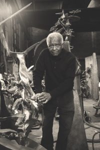 Image: Hunt later in his life in his studio surrounded by sculpture © 2024 The Richard Hunt Trust/Artists Rights Society (ARS), New York.  Photo credit: Cal Kowal 
