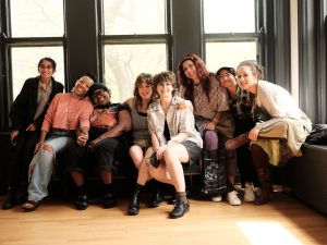 Image: A group photo of some members of the Sixty team at Haymarket House for the 2024 Midwest Arts Writers Convening. Image made by Seed Lynn.