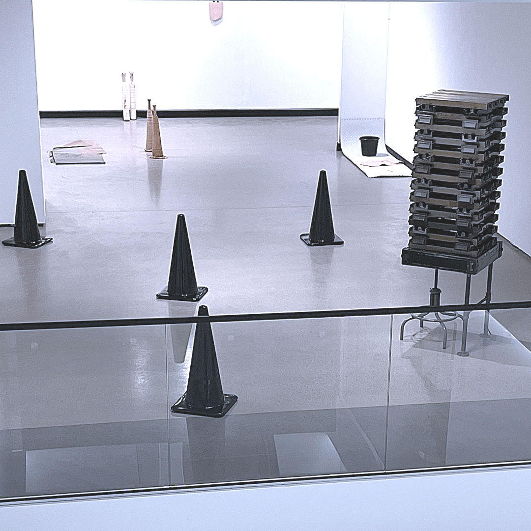 GIF: A photograph of the artwork exhibited at SAIC has an overlay of Tio and his non-gendered nephew illustrated over it with a text bubble that reads: One of the first connections when I arrived was the language.