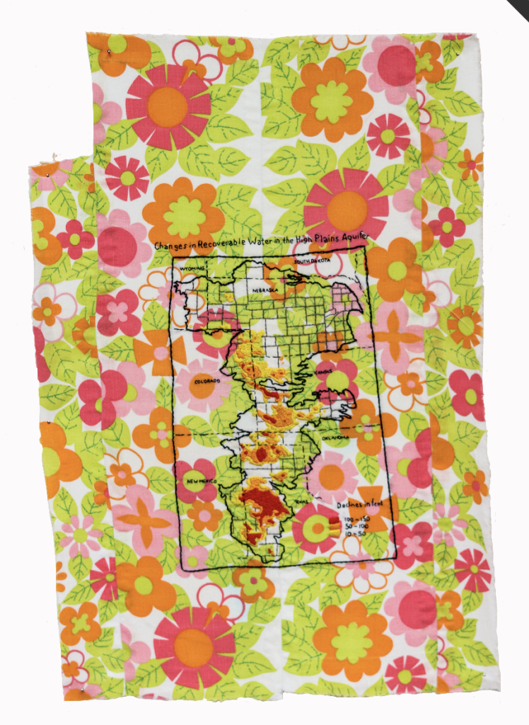 Image: Karen Reimer. Changes in Recoverable Water in the High Plains Aquifer, 2021. Image courtesy of the artist and Monique Meloche Gallery, Chicago IL. An image of a map on fabric patterned with green leaves, yellow flowers, and pink flowers.