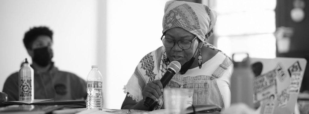 Image: Treasure Shields Redmond, shares reflections with the group during a convening session. Image made by Seed Lynn (@seedlynn).