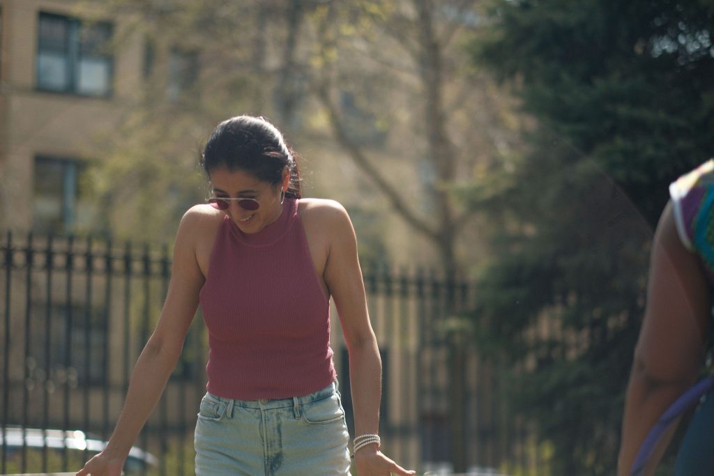 Image: Felicia Holman (right, off view) and Pia Singh (left), an independent curator and arts writer, engage in the joy of hula hooping during break in between convening sessions. Image made by Seed Lynn (@seedlynn).