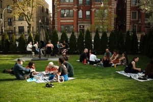 Image: Convening attendees discuss Convening topics in small groups on the lawn of Haymarket House on a sunny day in April. Image made by Seed Lynn (@seedlynn).
